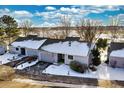 Aerial view of townhouse community with snow on the ground at 13739 E Marina Dr # B, Aurora, CO 80014