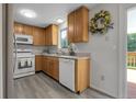Well-lit kitchen boasting wood cabinets, a modern microwave, and access to the outdoor patio at 4580 W 109Th Ave, Westminster, CO 80031