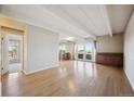 Bright and airy living room with hardwood floors and access to a balcony at 1441 N Humboldt St # 504, Denver, CO 80218