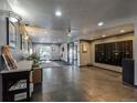 The lobby features tile floors, a mailroom, and a view of the outdoors at 1441 N Humboldt St # 504, Denver, CO 80218