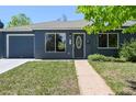 Charming single-story home with painted brick, attached garage, and well-maintained lawn at 971 Ursula St, Aurora, CO 80011