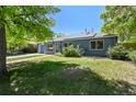 Charming single-story home with painted brick, attached garage, and well-maintained lawn at 971 Ursula St, Aurora, CO 80011