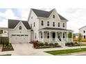 Beautiful two-story home with a covered front porch and a convenient two-car garage at 10106 E 59Th Pl, Denver, CO 80238