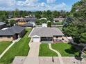 Lovely single-story home featuring a pristine lawn, complemented by mature trees and a serene neighborhood setting at 2321 Lima St, Aurora, CO 80010