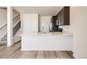 Bright kitchen featuring stainless steel appliances and a breakfast bar at 6562 Arbor Blvd # 3, Thornton, CO 80602