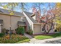 Charming townhome featuring mature landscaping and a welcoming entryway at 1995 S Xanadu Way, Aurora, CO 80014