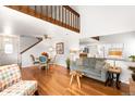 Bright living room with hardwood floors and vaulted ceilings at 1995 S Xanadu Way, Aurora, CO 80014