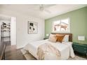 Cozy bedroom featuring a large window and stylish bedside tables at 3638 N Elizabeth St, Denver, CO 80205