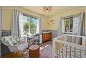 Bright Bedroom featuring natural light, hard wood floors and an accent wall at 1354 Tamarac St, Denver, CO 80220