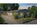 Inviting single-story home showcasing warm exterior lighting and a welcoming facade at 9021 Rampart St, Federal Heights, CO 80260