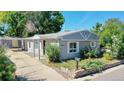 Attractive single-story home with an open driveway and manicured landscaping at 9021 Rampart St, Federal Heights, CO 80260