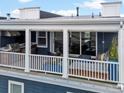 Inviting rooftop deck boasts an outdoor kitchen and comfortable seating area at 10252 E 58Th Ave, Denver, CO 80238