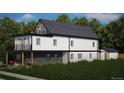 Rear elevation of a modern two-story home featuring a backyard, partial brick facade, and exterior access storage at 314 Galapago St, Denver, CO 80223