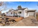 Charming home featuring a front porch with seating and a convenient covered parking area at 3256 S Glencoe St, Denver, CO 80222
