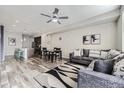 Cozy living room featuring modern decor, a ceiling fan, and an open-concept design at 623 S Pitkin Ct, Aurora, CO 80017