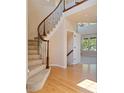 Elegant curved staircase with wrought iron railing at 13699 Pecos Loop, Broomfield, CO 80023