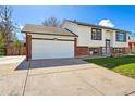 Two-car garage with driveway and attractive exterior at 5031 Upton Ct, Denver, CO 80239