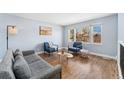 Bright living room showcasing modern furnishings, wood floors, and natural light at 5031 Upton Ct, Denver, CO 80239