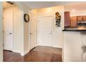 Entryway boasts hardwood floors, access to a kitchen, and a coat closet at 9019 E Panorama Cir # D207, Englewood, CO 80112