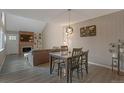 Cozy dining room showcasing hardwood floors and an adjacent living space at 11894 Elk Head Range Rd, Littleton, CO 80127
