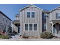 A well-maintained two-story home with modern siding and a manicured front yard at 15869 E Otero Ave, Centennial, CO 80112