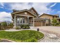 Attractive two-story home with a well-manicured lawn and a three-car garage at 15705 Red Deer Dr, Morrison, CO 80465