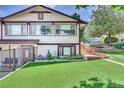 House exterior showcasing a well-maintained lawn and landscaping at 7475 W Kentucky Ave, Lakewood, CO 80226