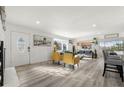 Bright and airy living room with hardwood floors and modern furniture at 7475 W Kentucky Ave, Lakewood, CO 80226