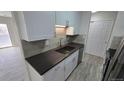 Modern kitchen with sleek countertops, stainless steel appliances, and white cabinetry at 100 E Highline Cir # 307, Centennial, CO 80122
