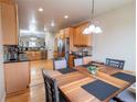 Bright kitchen with stainless steel appliances, granite countertops, and ample cabinet space at 9844 Norfolk St, Commerce City, CO 80022