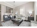Spacious living room with ample natural light and stylish decor at 3024 S Sherman St, Englewood, CO 80113