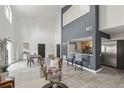 Bright living room with high ceilings, modern tile floors, open to the kitchen, and contemporary decor at 837 E 17Th Ave # 2K, Denver, CO 80218