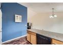 Cozy eat-in kitchen featuring granite countertops and wood cabinets at 18981 E Mercer Dr, Aurora, CO 80013
