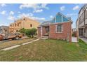 Quaint brick home with inviting curb appeal and a neatly landscaped front yard at 1425 Xavier St, Denver, CO 80204