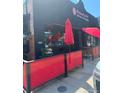 Building with a red umbrella and dining area outside at 3510 Wyandot St, Denver, CO 80211