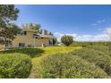 Spacious backyard with mature trees and greenery, offering privacy and space at 34 S Raleigh St, Denver, CO 80219