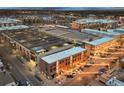 An aerial view of the brick building nestled in a vibrant urban neighborhood at 7110 W Alaska Dr # A, Lakewood, CO 80226