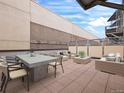Outdoor patio with comfortable seating and dining area for entertaining at 7110 W Alaska Dr # A, Lakewood, CO 80226