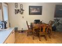 Cozy dining area adjacent to the kitchen with wood table and chairs at 3220 W 133Rd Cir, Broomfield, CO 80020
