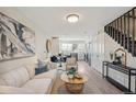 Spacious living room with an open floor plan, looking toward the kitchen at 4336 Decatur St, Denver, CO 80211