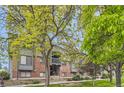 Exterior view of building showcasing mature trees, landscaping and access stairs at 3558 S Depew St # 302, Denver, CO 80235