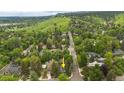 Aerial view showcasing a home nestled within a lush green neighborhood with mountain views at 1502 Columbine Ave, Boulder, CO 80302