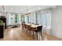 Dining room with hardwood floors, long table and chairs, and bright natural light at 1502 Columbine Ave, Boulder, CO 80302