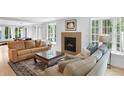 Bright living room featuring fireplace, hardwood floors, and comfortable seating at 1502 Columbine Ave, Boulder, CO 80302