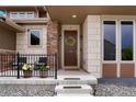 Welcoming front porch featuring stylish decor, comfortable seating, and a well-maintained entrance at 5737 Amarosa Dr, Parker, CO 80134