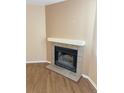 Living room fireplace with a tiled hearth and mantel at 5775 W Atlantic Pl # 103, Lakewood, CO 80227