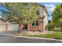 Charming home featuring mature landscaping with a lush green lawn and mature tree at 16753 W 61St Ln, Golden, CO 80403