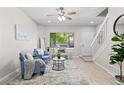 Inviting living room with large window, comfortable seating, and natural light at 10693 W 63Rd Dr # 106, Arvada, CO 80004