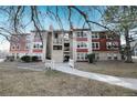 Front view of red building with landscaping and walkway at 2686 E Otero Pl # 12, Centennial, CO 80122