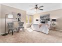 Comfortable main bedroom with neutral tones, carpet, and a ceiling fan at 2891 S Vaughn Way, Aurora, CO 80014